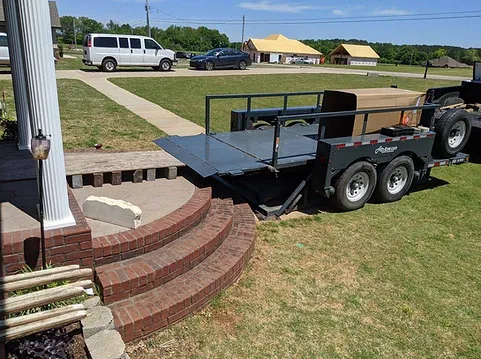 A trailer is parked on the side of a road.