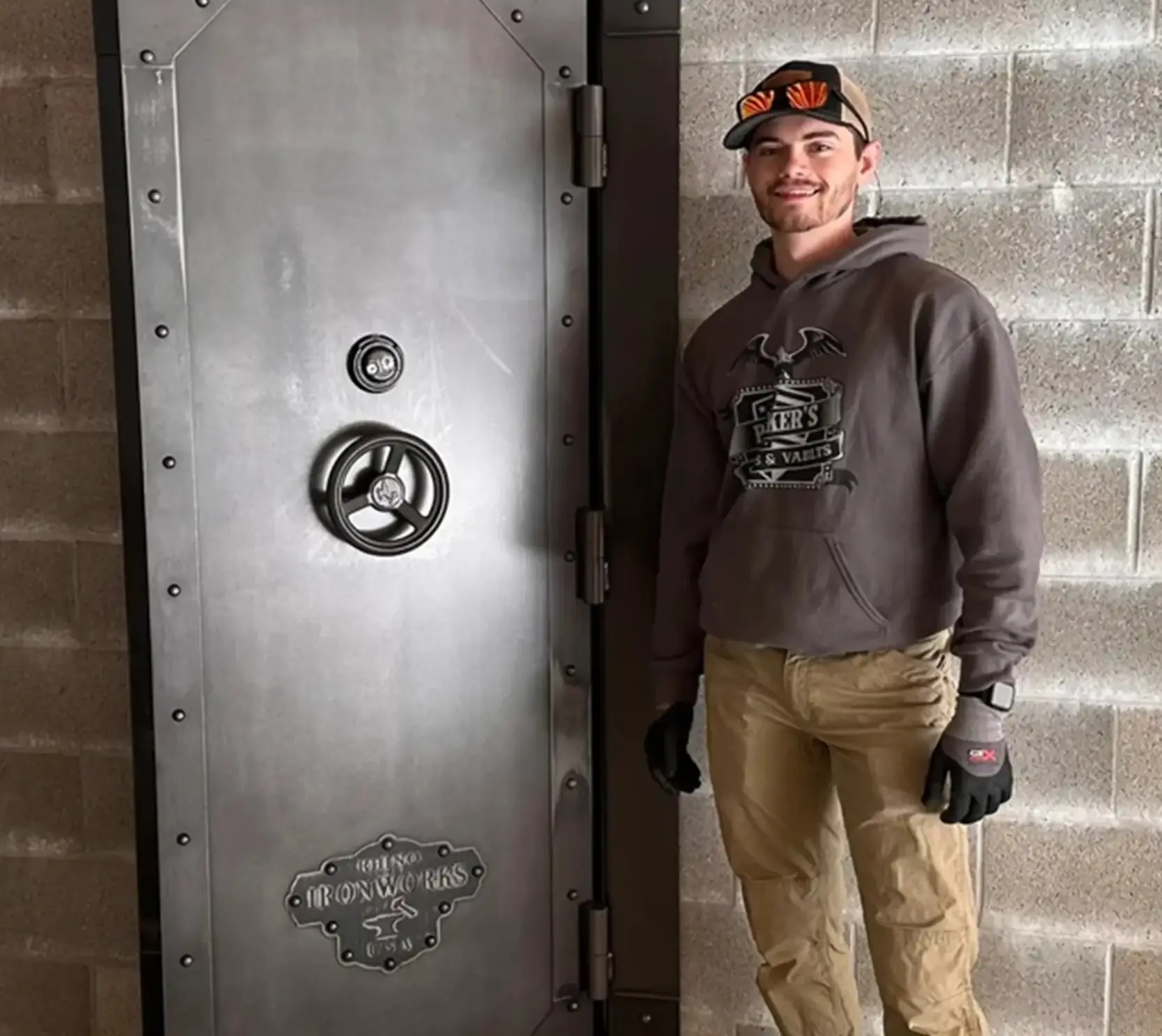 A man standing next to an open door.