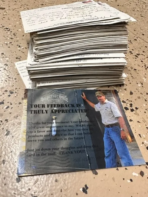 A stack of newspapers with an image on the front.