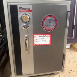 A metal cabinet with a clock and a thermometer on it.