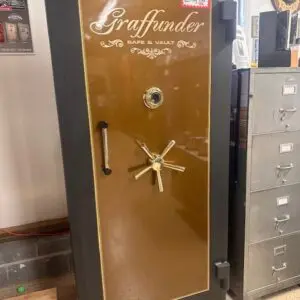 A large brown and black safe in a room.