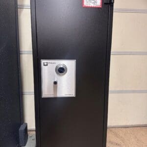 A black and silver safe in a room.