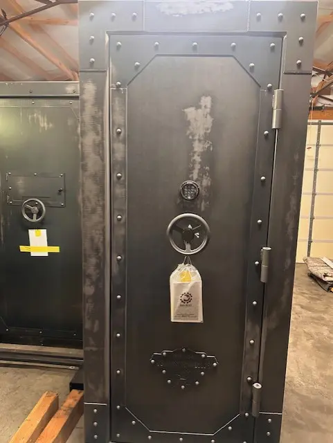 A large black metal door with a lock.