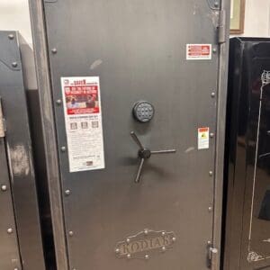 A large metal safe with a lock and key.