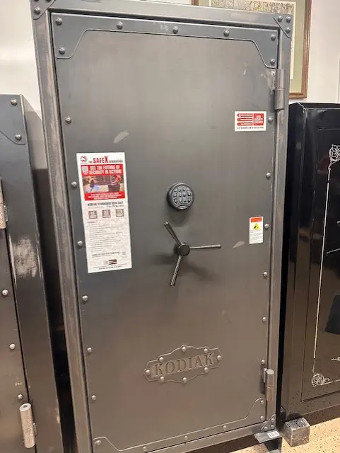 A large metal safe with a lock and key.