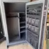 Gray gun safe with interior storage.